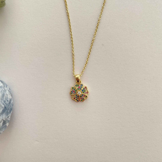Gold filled schakelkettinkje met bedel bloemetje met zirkonia's