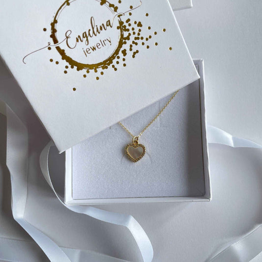 Gold filled schakelkettinkje met bedel hartje van parelmoer