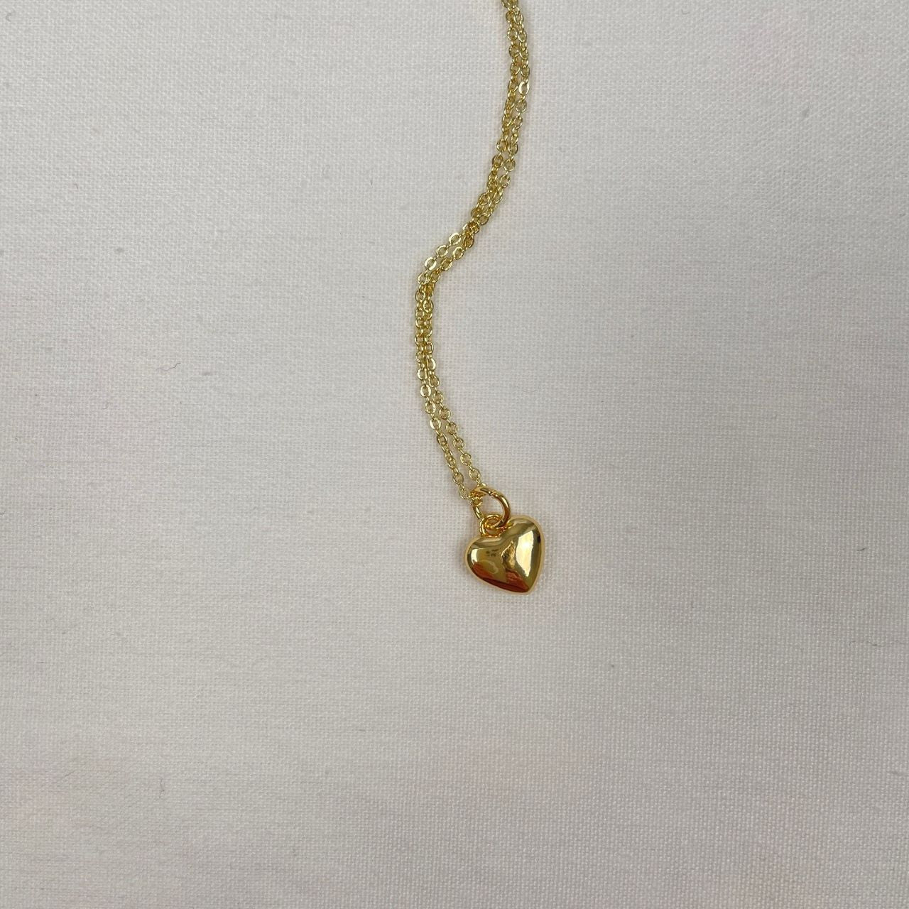 Goldfilled schakelkettinkje met bol bedel hartje