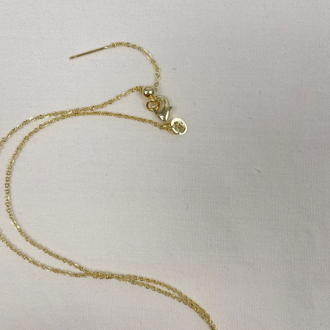 Goldfilled schakelkettinkje met bol bedel hartje